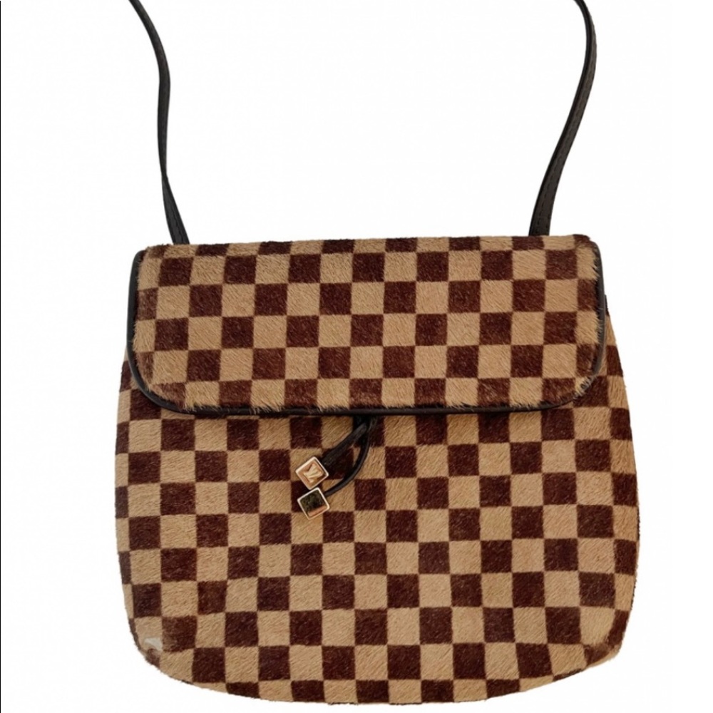 Limited edition Louis Vuitton Damier Sauvage crossbody/belt bag.